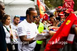 Lewis Hamilton (GBR) Mercedes AMG F1 signs autographs for the fans. 05.09.2019. Formula 1 World Championship, Rd 14, Italian Grand Prix, Monza, Italy, Preparation Day.
