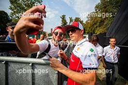 Kimi Raikkonen (FIN) Alfa Romeo Racing with fans. 05.09.2019. Formula 1 World Championship, Rd 14, Italian Grand Prix, Monza, Italy, Preparation Day.