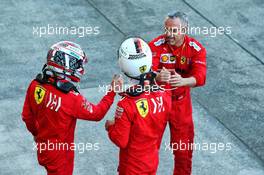 (L to R): Charles Leclerc (MON) Ferrari with Sebastian Vettel (GER) Ferrari in parc ferme. 13.10.2019. Formula 1 World Championship, Rd 17, Japanese Grand Prix, Suzuka, Japan, Sunday.
