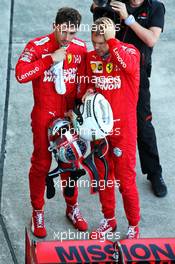 (L to R): Charles Leclerc (MON) Ferrari with team mate Sebastian Vettel (GER) Ferrari in parc ferme. 13.10.2019. Formula 1 World Championship, Rd 17, Japanese Grand Prix, Suzuka, Japan, Sunday.