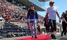Carlos Sainz Jr (ESP) McLaren and Daniil Kvyat (RUS) Scuderia Toro Rosso on the drivers parade. 13.10.2019. Formula 1 World Championship, Rd 17, Japanese Grand Prix, Suzuka, Japan, Sunday.