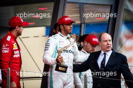 Race winner Lewis Hamilton (GBR) Mercedes AMG F1 celebrates on the podium with HSH Prince Albert of Monaco (MON). 26.05.2019. Formula 1 World Championship, Rd 6, Monaco Grand Prix, Monte Carlo, Monaco, Race Day.