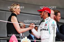 (L to R): Princess Charlene of Monaco on the podium with race winner Lewis Hamilton (GBR) Mercedes AMG F1. 26.05.2019. Formula 1 World Championship, Rd 6, Monaco Grand Prix, Monte Carlo, Monaco, Race Day.
