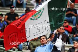Circuit atmosphere - Sergio Perez (MEX) Racing Point F1 Team fan waves a Mexican flag. 25.10.2019. Formula 1 World Championship, Rd 18, Mexican Grand Prix, Mexico City, Mexico, Practice Day.