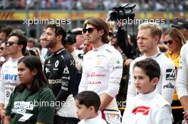 Antonio Giovinazzi (ITA) Alfa Romeo Racing as the grid observes the national anthem. 27.10.2019. Formula 1 World Championship, Rd 18, Mexican Grand Prix, Mexico City, Mexico, Race Day.