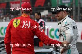 Sebastian Vettel (GER) Ferrari SF90 and Valtteri Bottas (FIN) Mercedes AMG F1 W10. 27.10.2019. Formula 1 World Championship, Rd 18, Mexican Grand Prix, Mexico City, Mexico, Race Day.
