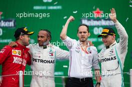 1st place Lewis Hamilton (GBR) Mercedes AMG F1 W10, with Sebastian Vettel (GER) Ferrari SF90 and Valtteri Bottas (FIN) Mercedes AMG F1 W10. 27.10.2019. Formula 1 World Championship, Rd 18, Mexican Grand Prix, Mexico City, Mexico, Race Day.