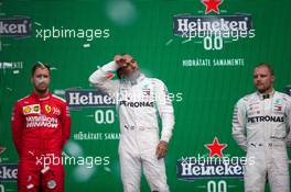 1st place Lewis Hamilton (GBR) Mercedes AMG F1 W10, with Sebastian Vettel (GER) Ferrari SF90 and Valtteri Bottas (FIN) Mercedes AMG F1 W10. 27.10.2019. Formula 1 World Championship, Rd 18, Mexican Grand Prix, Mexico City, Mexico, Race Day.
