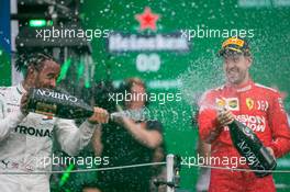 Lewis Hamilton (GBR) Mercedes AMG F1 W10 and Sebastian Vettel (GER) Ferrari SF90.  27.10.2019. Formula 1 World Championship, Rd 18, Mexican Grand Prix, Mexico City, Mexico, Race Day.