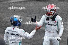 Race winner Lewis Hamilton (GBR) Mercedes AMG F1 celebrates with team mate Valtteri Bottas (FIN) Mercedes AMG F1 in parc ferme. 27.10.2019. Formula 1 World Championship, Rd 18, Mexican Grand Prix, Mexico City, Mexico, Race Day.