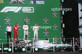 1st place Lewis Hamilton (GBR) Mercedes AMG F1 W10 with 2nd place Sebastian Vettel (GER) Ferrari SF90 and 3rd place Valtteri Bottas (FIN) Mercedes AMG F1 W10. 27.10.2019. Formula 1 World Championship, Rd 18, Mexican Grand Prix, Mexico City, Mexico, Race Day.