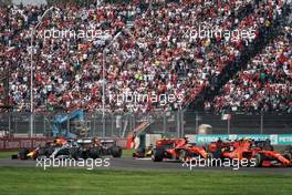 Max Verstappen (NLD) Red Bull Racing RB15 and Lewis Hamilton (GBR) Mercedes AMG F1 W10 run wide at the start of the race. 27.10.2019. Formula 1 World Championship, Rd 18, Mexican Grand Prix, Mexico City, Mexico, Race Day.