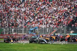 Max Verstappen (NLD) Red Bull Racing RB15 and Lewis Hamilton (GBR) Mercedes AMG F1 W10 run wide at the start of the race. 27.10.2019. Formula 1 World Championship, Rd 18, Mexican Grand Prix, Mexico City, Mexico, Race Day.