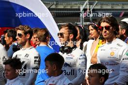 Pierre Gasly (FRA) Scuderia Toro Rosso as the grid observes the national anthem. 29.09.2019. Formula 1 World Championship, Rd 16, Russian Grand Prix, Sochi Autodrom, Sochi, Russia, Race Day.