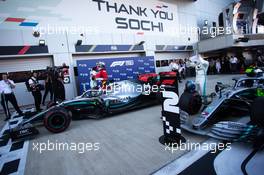 (L to R): Race winner Lewis Hamilton (GBR) Mercedes AMG F1 with Charles Leclerc (MON) Ferrari and Valtteri Bottas (FIN) Mercedes AMG F1 in parc ferme. 29.09.2019. Formula 1 World Championship, Rd 16, Russian Grand Prix, Sochi Autodrom, Sochi, Russia, Race Day.