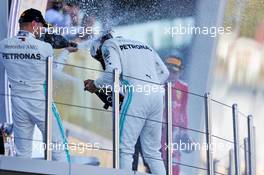 (L to R): Valtteri Bottas (FIN) Mercedes AMG F1 celebrates his second position on the podium with race winner Lewis Hamilton (GBR) Mercedes AMG F1. 29.09.2019. Formula 1 World Championship, Rd 16, Russian Grand Prix, Sochi Autodrom, Sochi, Russia, Race Day.