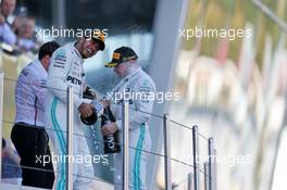 Race winner Lewis Hamilton (GBR) Mercedes AMG F1 celebrates on the podium with second placed team mate Valtteri Bottas (FIN) Mercedes AMG F1. 29.09.2019. Formula 1 World Championship, Rd 16, Russian Grand Prix, Sochi Autodrom, Sochi, Russia, Race Day.