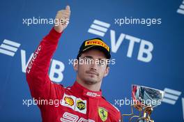 Charles Leclerc (MON) Ferrari celebrates his third position on the podium. 29.09.2019. Formula 1 World Championship, Rd 16, Russian Grand Prix, Sochi Autodrom, Sochi, Russia, Race Day.