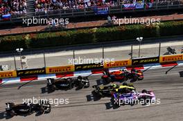 Max Verstappen (NLD) Red Bull Racing RB15, Nico Hulkenberg (GER) Renault F1 Team RS19, and Sergio Perez (MEX) Racing Point F1 Team RP19 at the start of the race. 29.09.2019. Formula 1 World Championship, Rd 16, Russian Grand Prix, Sochi Autodrom, Sochi, Russia, Race Day.