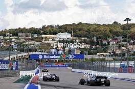 Sergio Perez (MEX) Racing Point F1 Team RP19 and Valtteri Bottas (FIN) Mercedes AMG F1 W10. 28.09.2019. Formula 1 World Championship, Rd 16, Russian Grand Prix, Sochi Autodrom, Sochi, Russia, Qualifying Day.