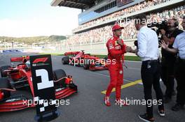 pole position for Charles Leclerc (MON) Ferrari SF90 and talks with Jenson Button. 28.09.2019. Formula 1 World Championship, Rd 16, Russian Grand Prix, Sochi Autodrom, Sochi, Russia, Qualifying Day.