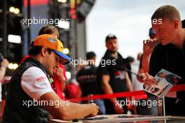 Carlos Sainz Jr (ESP) McLaren signs autographs for the fans. 26.09.2019. Formula 1 World Championship, Rd 16, Russian Grand Prix, Sochi Autodrom, Sochi, Russia, Preparation Day.