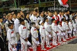 Drivers as the grid observes the national anthem. 22.09.2019. Formula 1 World Championship, Rd 15, Singapore Grand Prix, Marina Bay Street Circuit, Singapore, Race Day.