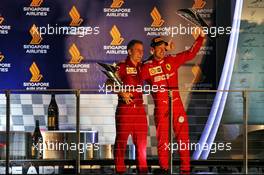 Race winner Sebastian Vettel (GER) Ferrari celebrates with Inaki Rueda (ESP) Ferrari Race Strategist on the podium. 22.09.2019. Formula 1 World Championship, Rd 15, Singapore Grand Prix, Marina Bay Street Circuit, Singapore, Race Day.