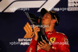 Race winner Sebastian Vettel (GER) Ferrari celebrates on the podium. 22.09.2019. Formula 1 World Championship, Rd 15, Singapore Grand Prix, Marina Bay Street Circuit, Singapore, Race Day.