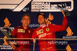 (L to R): Inaki Rueda (ESP) Ferrari Race Strategist celebrates on the podium with race winner Sebastian Vettel (GER) Ferrari. 22.09.2019. Formula 1 World Championship, Rd 15, Singapore Grand Prix, Marina Bay Street Circuit, Singapore, Race Day.