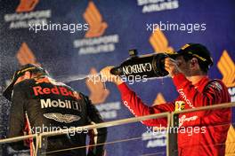 (L to R): Max Verstappen (NLD) Red Bull Racing celebrates his third position on the podium with second placed Charles Leclerc (MON) Ferrari. 22.09.2019. Formula 1 World Championship, Rd 15, Singapore Grand Prix, Marina Bay Street Circuit, Singapore, Race Day.
