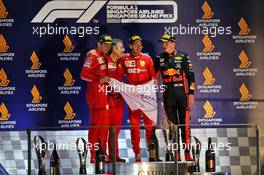 The podium (L to R): Charles Leclerc (MON) Ferrari, second; Inaki Rueda (ESP) Ferrari Race Strategist; Sebastian Vettel (GER) Ferrari, race winner; Max Verstappen (NLD) Red Bull Racing, third. 22.09.2019. Formula 1 World Championship, Rd 15, Singapore Grand Prix, Marina Bay Street Circuit, Singapore, Race Day.