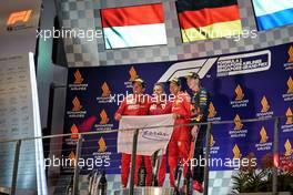 The podium (L to R): Charles Leclerc (MON) Ferrari, second; Inaki Rueda (ESP) Ferrari Race Strategist; Sebastian Vettel (GER) Ferrari, race winner; Max Verstappen (NLD) Red Bull Racing, third. 22.09.2019. Formula 1 World Championship, Rd 15, Singapore Grand Prix, Marina Bay Street Circuit, Singapore, Race Day.