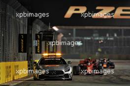 Sebastian Vettel (GER) Ferrari SF90 leads behind the FIA Safety Car. 22.09.2019. Formula 1 World Championship, Rd 15, Singapore Grand Prix, Marina Bay Street Circuit, Singapore, Race Day.