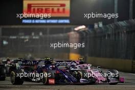 Pierre Gasly (FRA) Scuderia Toro Rosso STR14 and Lance Stroll (CDN) Racing Point F1 Team RP19 battle for position. 22.09.2019. Formula 1 World Championship, Rd 15, Singapore Grand Prix, Marina Bay Street Circuit, Singapore, Race Day.