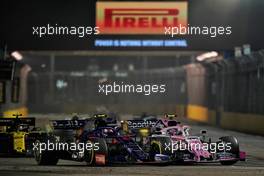 Pierre Gasly (FRA) Scuderia Toro Rosso STR14 and Lance Stroll (CDN) Racing Point F1 Team RP19 battle for position.                                22.09.2019. Formula 1 World Championship, Rd 15, Singapore Grand Prix, Marina Bay Street Circuit, Singapore, Race Day.