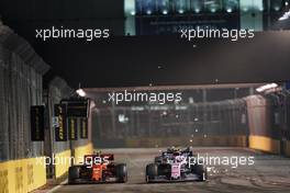 Charles Leclerc (MON) Ferrari SF90 and Lance Stroll (CDN) Racing Point F1 Team RP19 battle for position. 22.09.2019. Formula 1 World Championship, Rd 15, Singapore Grand Prix, Marina Bay Street Circuit, Singapore, Race Day.