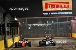 Sebastian Vettel (GER) Ferrari SF90 and Antonio Giovinazzi (ITA) Alfa Romeo Racing C38 battle for position. 22.09.2019. Formula 1 World Championship, Rd 15, Singapore Grand Prix, Marina Bay Street Circuit, Singapore, Race Day.