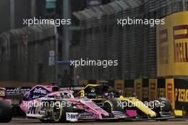 Sergio Perez (MEX) Racing Point F1 Team RP19 and Daniel Ricciardo (AUS) Renault F1 Team RS19 battle for position. 22.09.2019. Formula 1 World Championship, Rd 15, Singapore Grand Prix, Marina Bay Street Circuit, Singapore, Race Day.