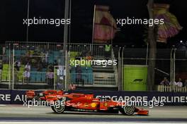 Sebastian Vettel (GER) Ferrari SF90 passes team mate Charles Leclerc (MON) Ferrari SF90 as he exits from his pit stop. 22.09.2019. Formula 1 World Championship, Rd 15, Singapore Grand Prix, Marina Bay Street Circuit, Singapore, Race Day.