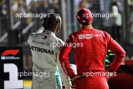 (L to R): Lewis Hamilton (GBR) Mercedes AMG F1 with Sebastian Vettel (GER) Ferrari in qualifying parc ferme. 21.09.2019. Formula 1 World Championship, Rd 15, Singapore Grand Prix, Marina Bay Street Circuit, Singapore, Qualifying Day.