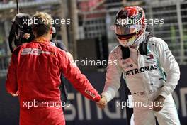 (L to R): Sebastian Vettel (GER) Ferrari with Lewis Hamilton (GBR) Mercedes AMG F1 in qualifying parc ferme. 21.09.2019. Formula 1 World Championship, Rd 15, Singapore Grand Prix, Marina Bay Street Circuit, Singapore, Qualifying Day.
