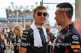 (L to R): George Russell (GBR) Williams Racing with Alexander Albon (THA) Red Bull Racing on the drivers parade. 22.09.2019. Formula 1 World Championship, Rd 15, Singapore Grand Prix, Marina Bay Street Circuit, Singapore, Race Day.