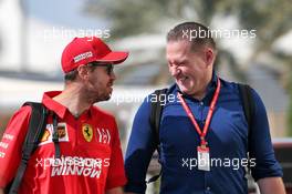 (L to R): Sebastian Vettel (GER) Ferrari with Jos Verstappen (NLD). 29.11.2019. Formula 1 World Championship, Rd 21, Abu Dhabi Grand Prix, Yas Marina Circuit, Abu Dhabi, Practice Day.