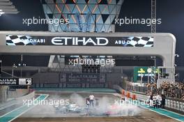 Race winner Lewis Hamilton (GBR) Mercedes AMG F1 W10 and second placed Max Verstappen (NLD) Red Bull Racing RB15 celebrate at the end of the race. 01.12.2019. Formula 1 World Championship, Rd 21, Abu Dhabi Grand Prix, Yas Marina Circuit, Abu Dhabi, Race Day.