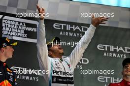 Race winner Lewis Hamilton (GBR) Mercedes AMG F1 celebrates on the podium. 01.12.2019. Formula 1 World Championship, Rd 21, Abu Dhabi Grand Prix, Yas Marina Circuit, Abu Dhabi, Race Day.