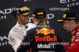 (L to R): Lewis Hamilton (GBR) Mercedes AMG F1, Max Verstappen (NLD) Red Bull Racing, and Charles Leclerc (MON) Ferrari, on the podium. 01.12.2019. Formula 1 World Championship, Rd 21, Abu Dhabi Grand Prix, Yas Marina Circuit, Abu Dhabi, Race Day.