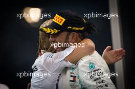 Race winner Lewis Hamilton (GBR) Mercedes AMG F1 celebrates on the podium with Britta Seeger, Member of the Board of Management for Mercedes-Benz Cars Marketing and Sales. 01.12.2019. Formula 1 World Championship, Rd 21, Abu Dhabi Grand Prix, Yas Marina Circuit, Abu Dhabi, Race Day.