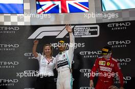 (L to R): Britta Seeger, Member of the Board of Management for Mercedes-Benz Cars Marketing and Sales and race winner Lewis Hamilton (GBR) Mercedes AMG F1 celebrate on the podium. 01.12.2019. Formula 1 World Championship, Rd 21, Abu Dhabi Grand Prix, Yas Marina Circuit, Abu Dhabi, Race Day.