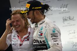 Race winner Lewis Hamilton (GBR) Mercedes AMG F1 celebrates on the podium with Britta Seeger, Member of the Board of Management for Mercedes-Benz Cars Marketing and Sales. 01.12.2019. Formula 1 World Championship, Rd 21, Abu Dhabi Grand Prix, Yas Marina Circuit, Abu Dhabi, Race Day.